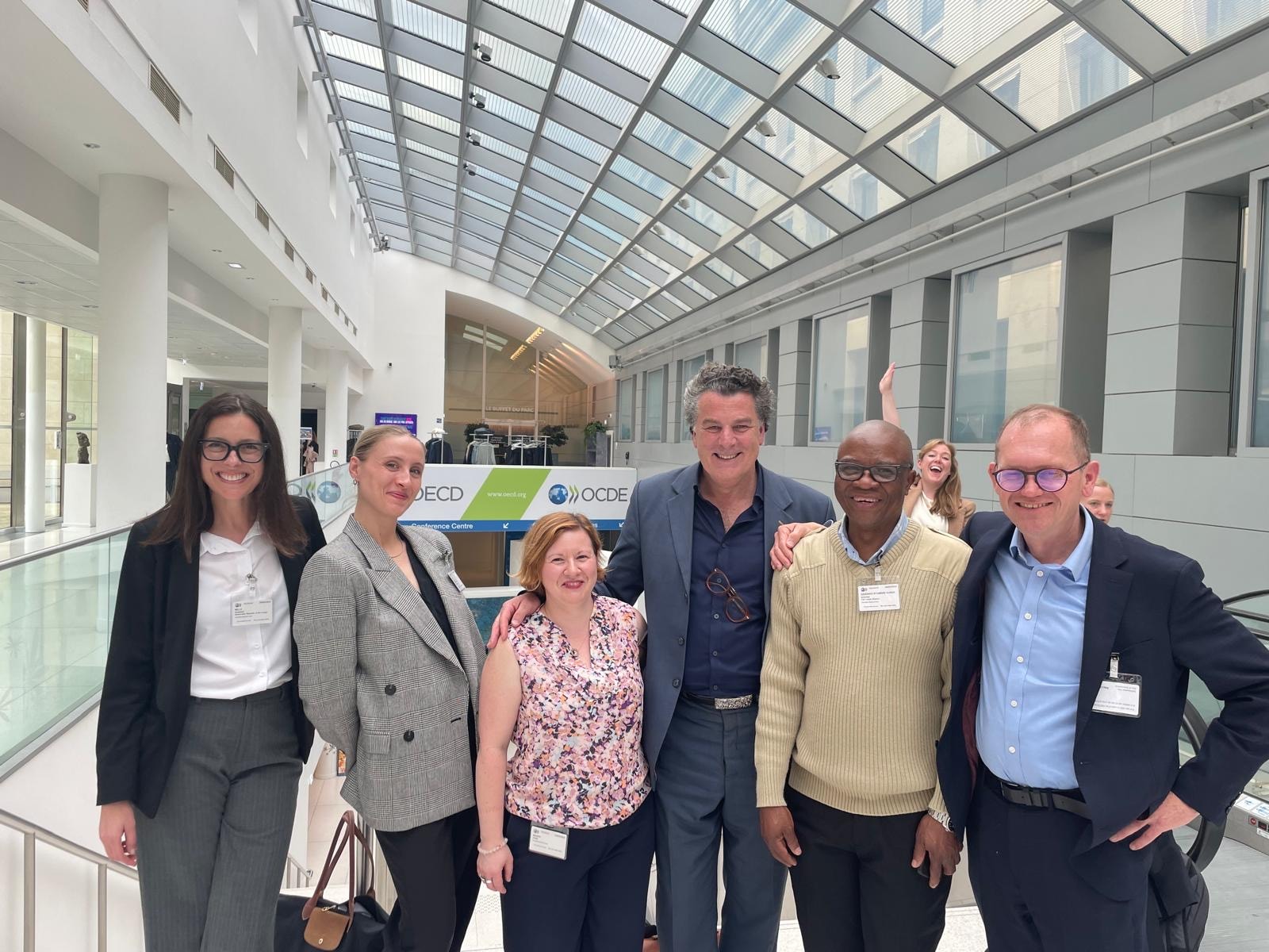Assheton with colleagues at the OECD Conference Centre